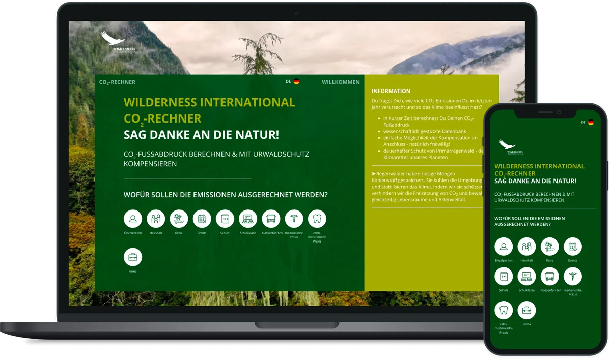 Laptop and smartphone displaying Wilderness International website with green design featuring CO₂ calculator and forest conservation.